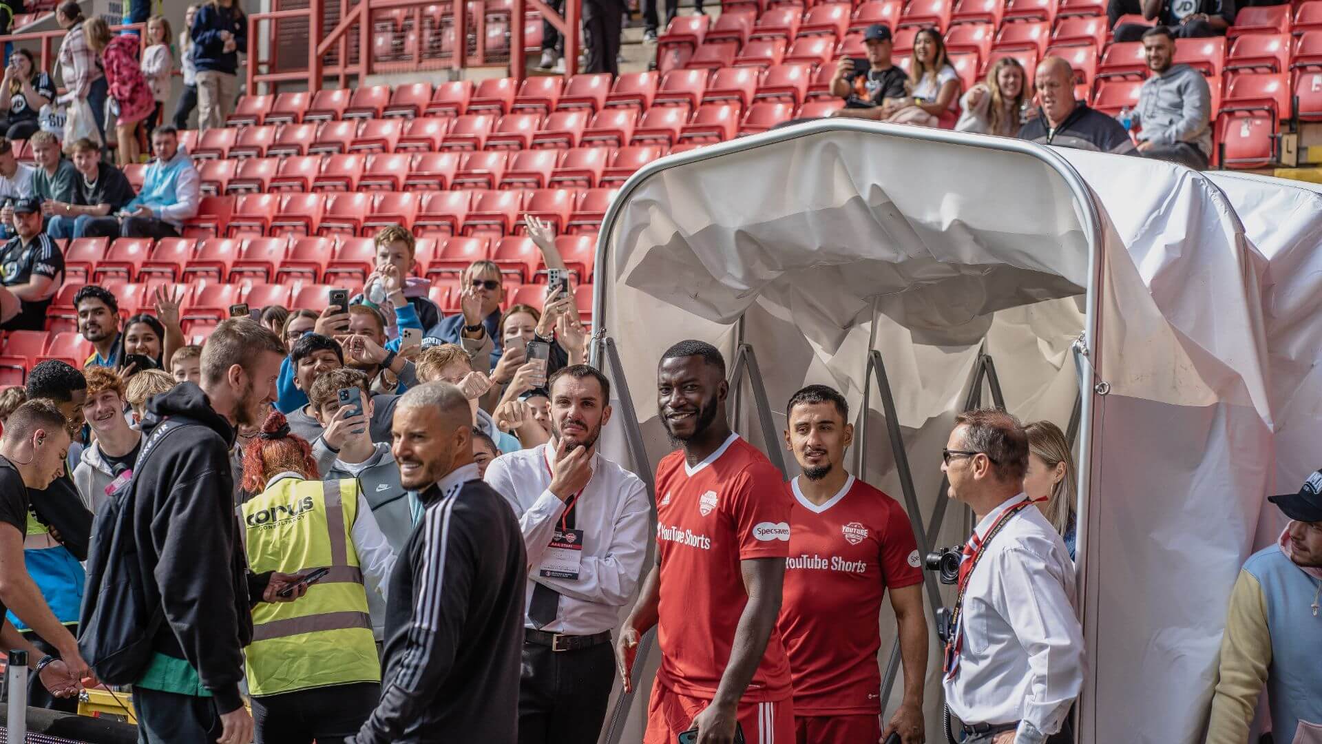 Harry Pinero and AnEsonGib coming out of the player tunnel prior to the match starting.