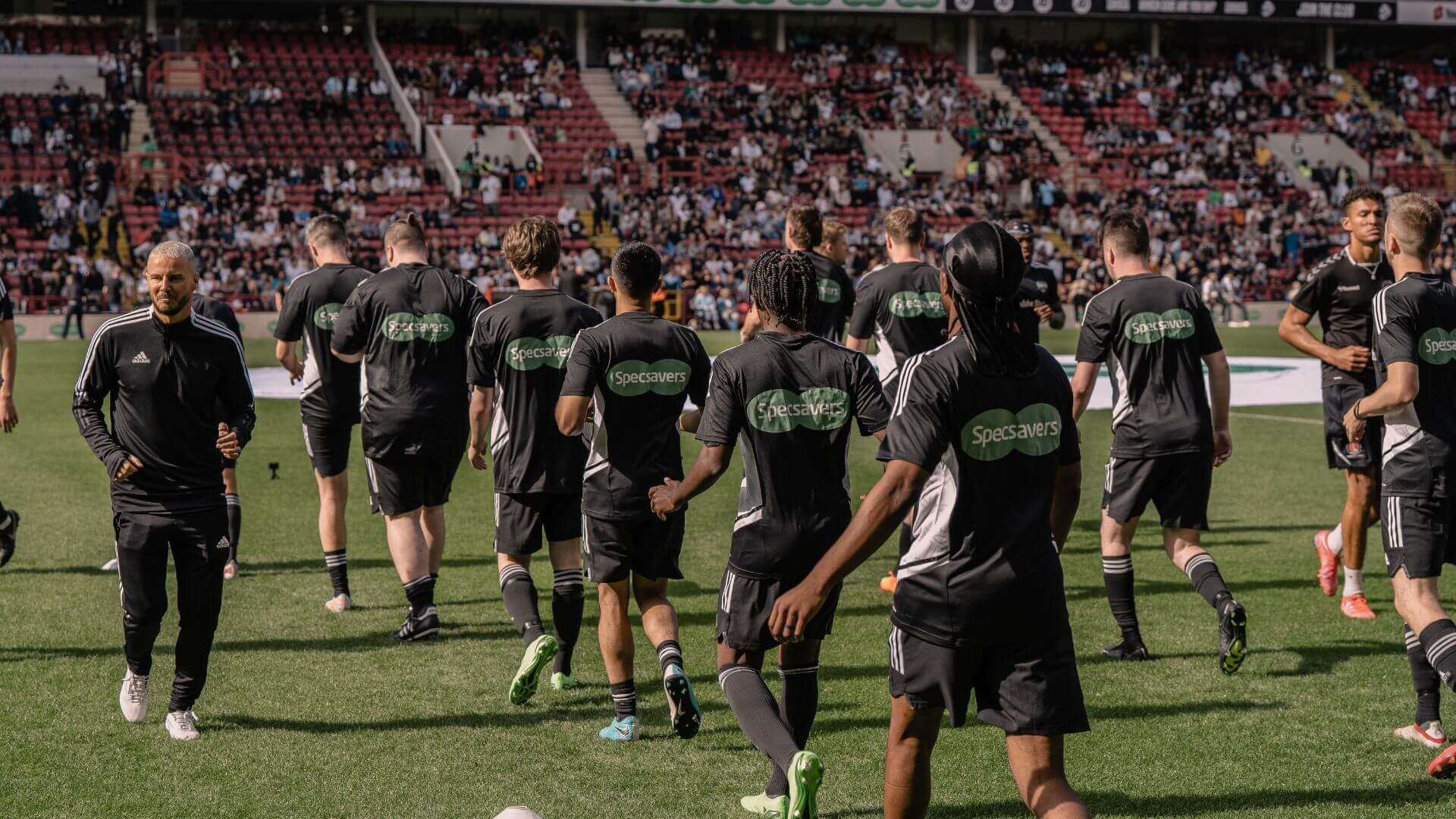 Sidemen FC going on pitch to warm-up.