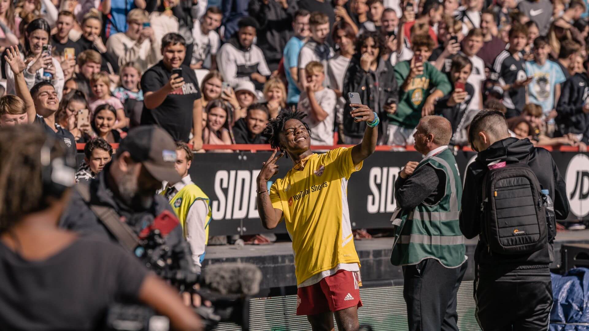 Speed taking a selfie with the crowd at the Sidemen 2022 Charity Football Match.