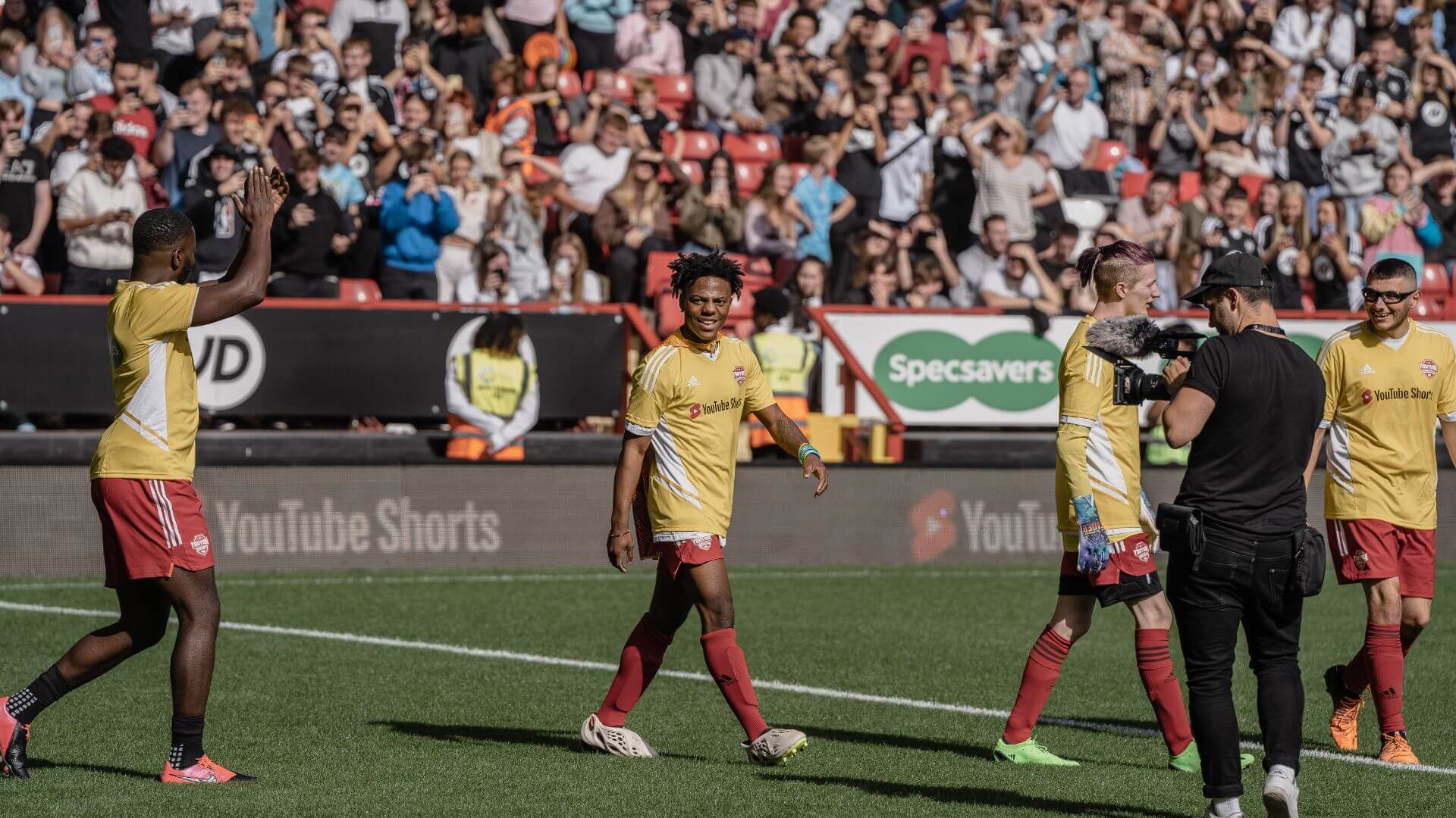 YouTube Allstars walking on pitch to start the Sidemen Charity match.