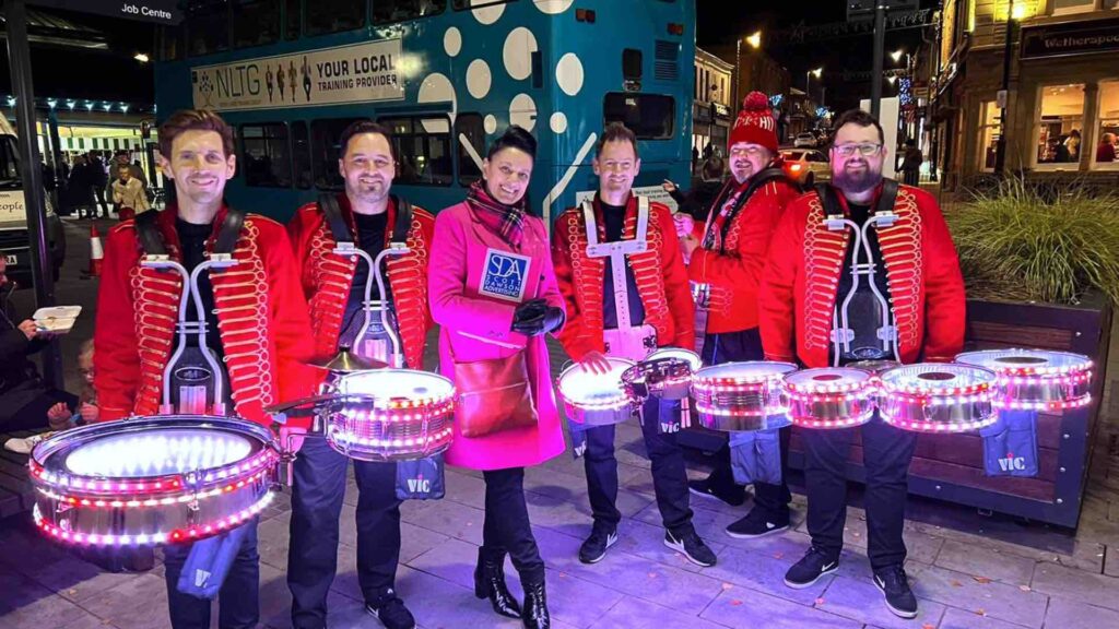 Drum group entertain at Christmas Parades