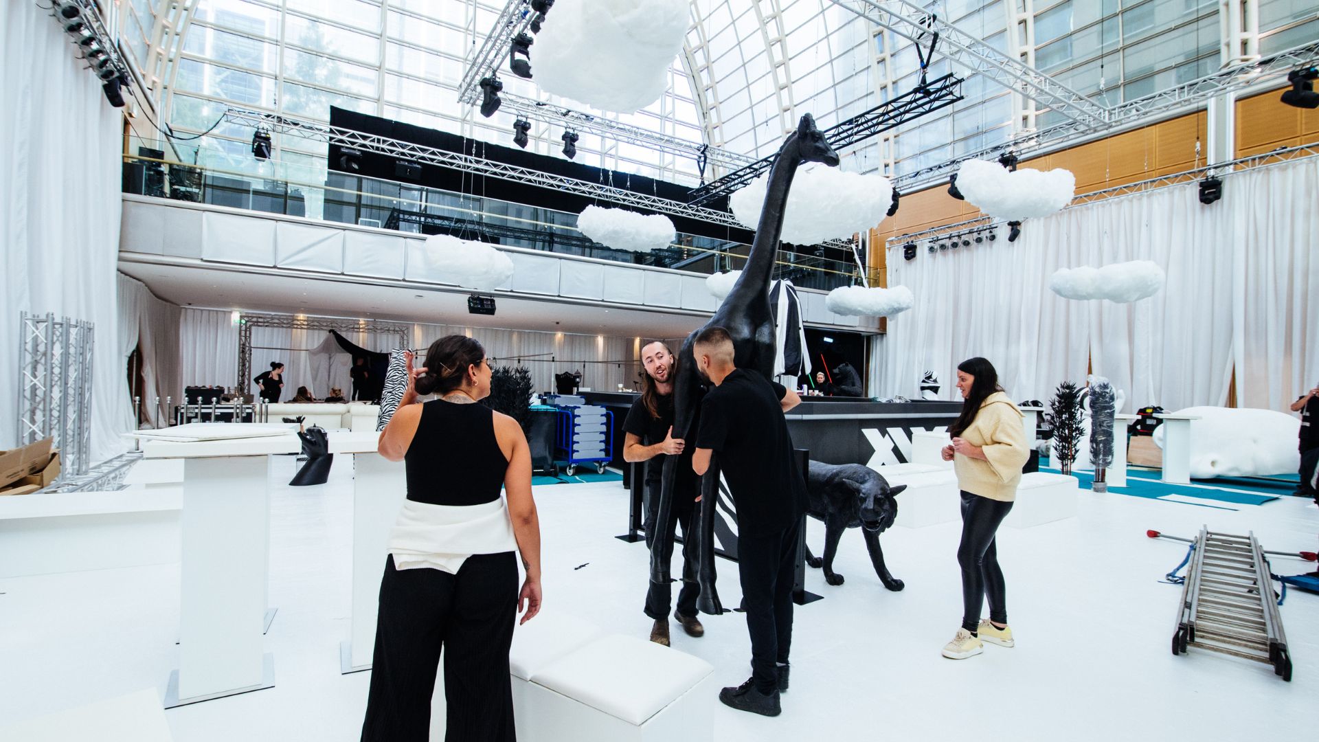 Team moving giant black giraffe prop to transform the event space for the Sidemen After Party 2022.