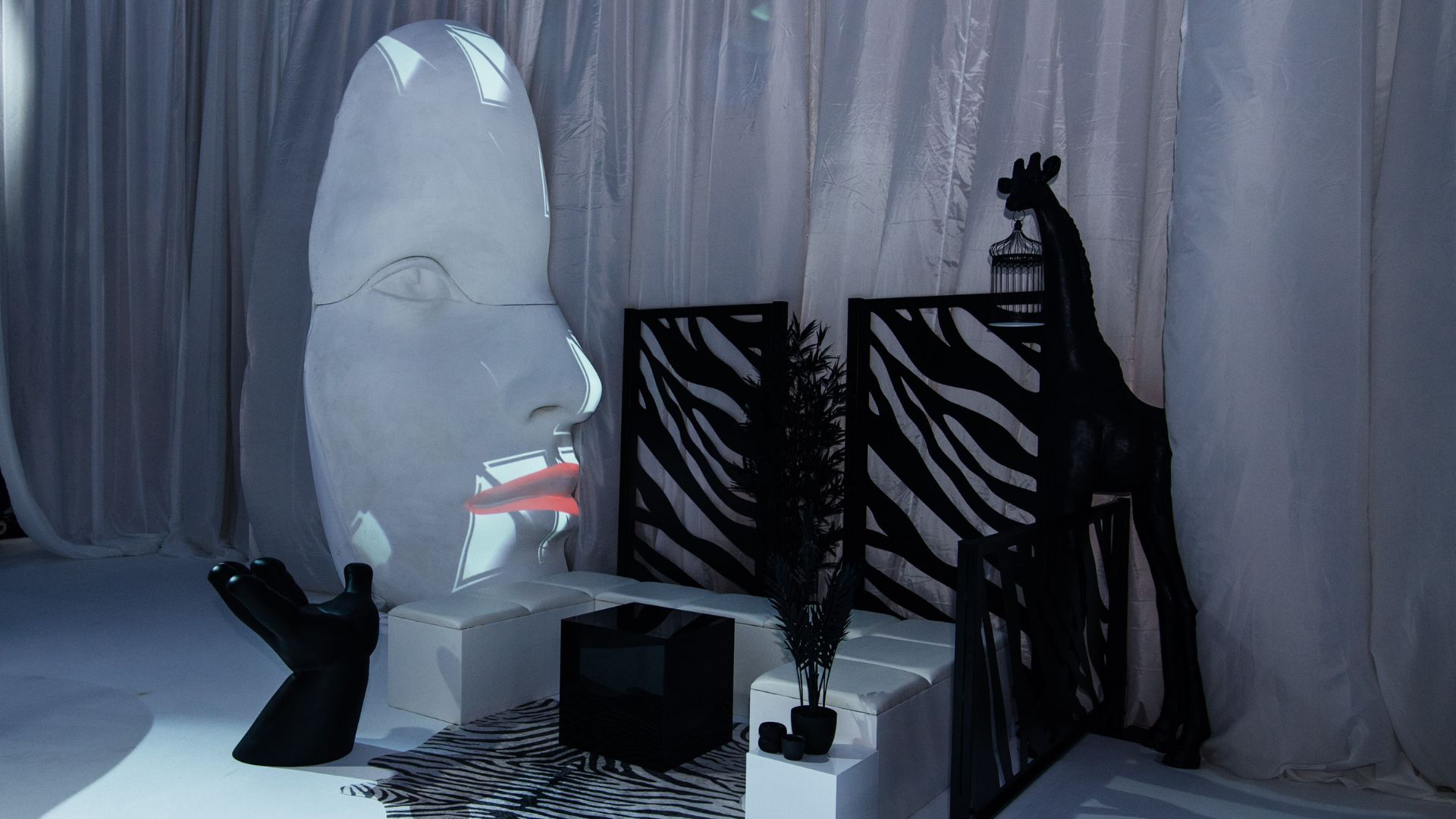 Sidemen Charity Match 2022 After Party seating area and giraffe prop.