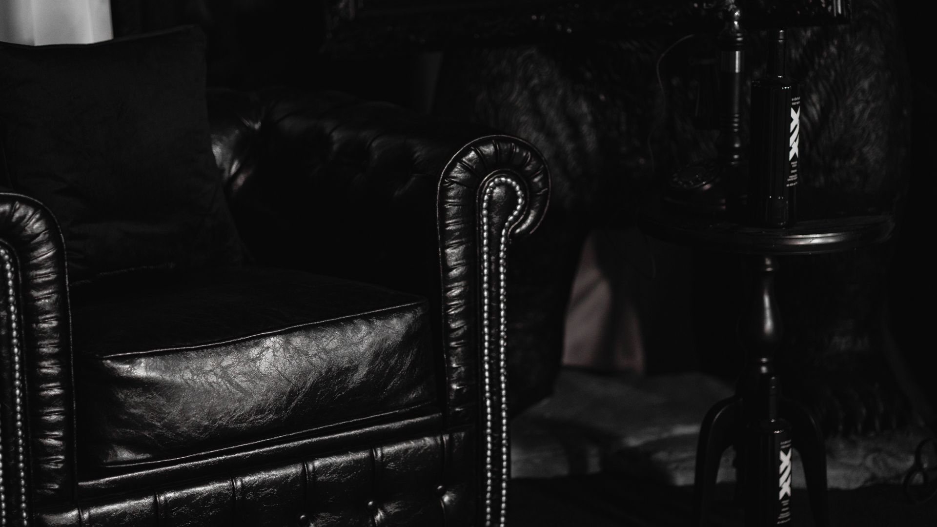 Black furniture and props used in the photo booth.
