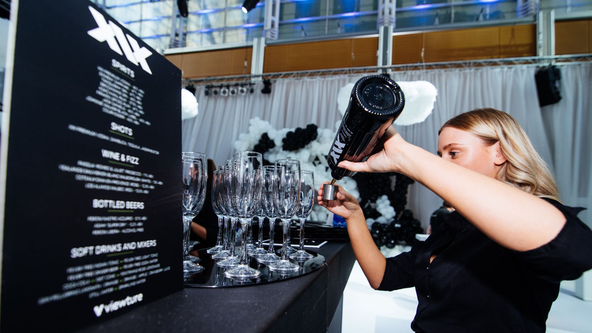 Bar staff pouring drinks ready for the guests to arrive at the Sidemen 2022 Charity Football Match After Party.