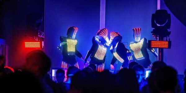 Glow-Performers-Dance-On-Stage