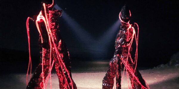 Glowing-Red-Stilt-Performers