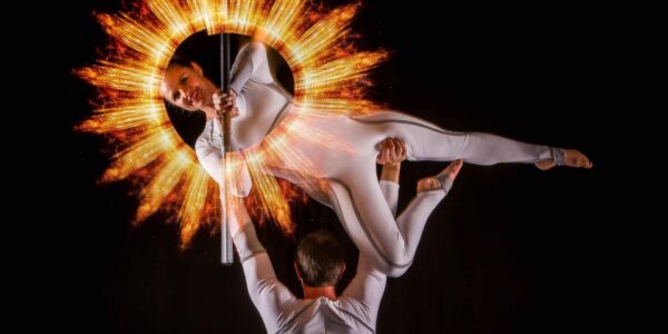 Acrobatic-Performers-Create-Sun-With-Light-Staff