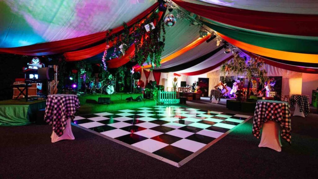 Unique Alice In Wonderland Themed Event Space including dance floor, draping and lighting.