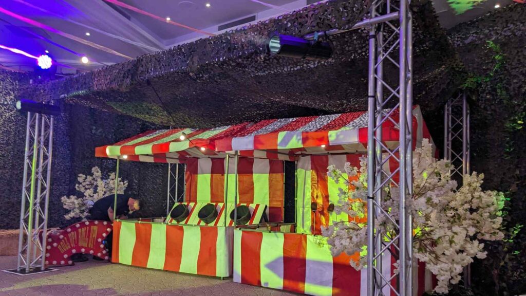 Red and white circus style festival circus tent pop-ups for corporate festival event.