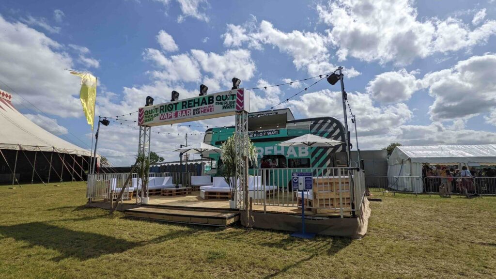 Riot rehab festival roadshow bus build in-person showing entrance, decking and side of bus.