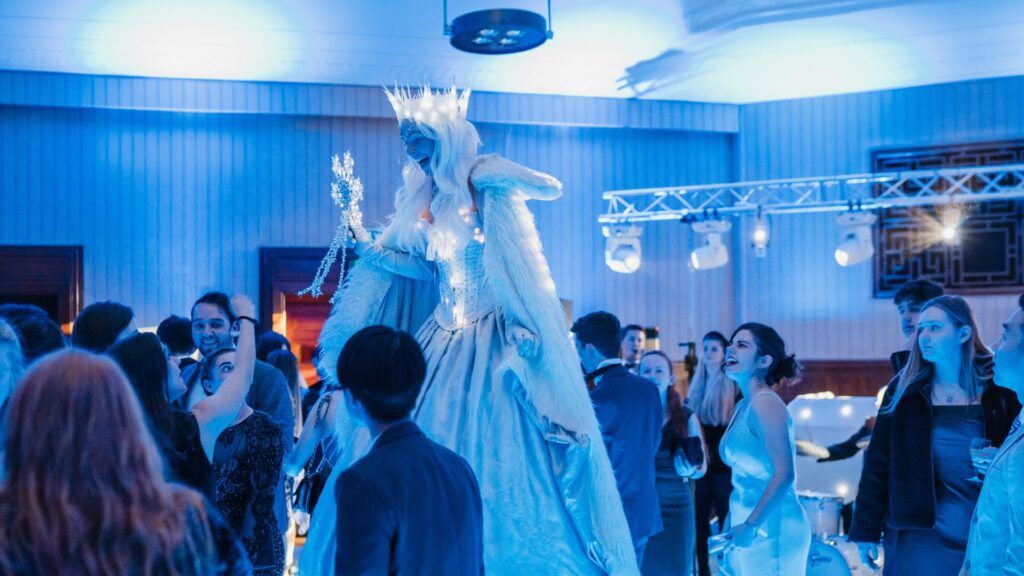 Winter Wonderland themed stilt walker roaming Christmas Party event.