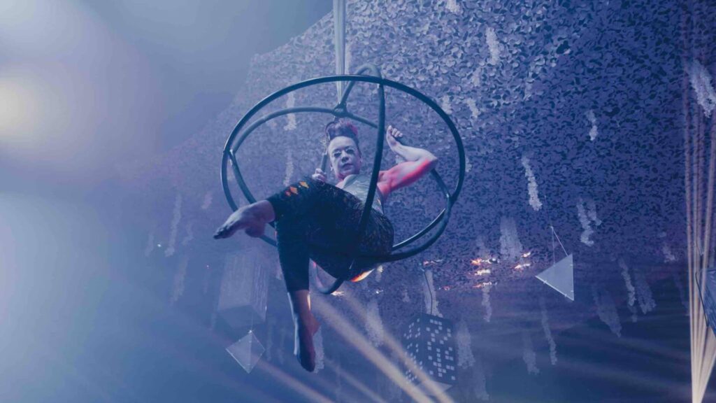 Sidemen XIX Vodka Launch aerialist hanging from rigging.
