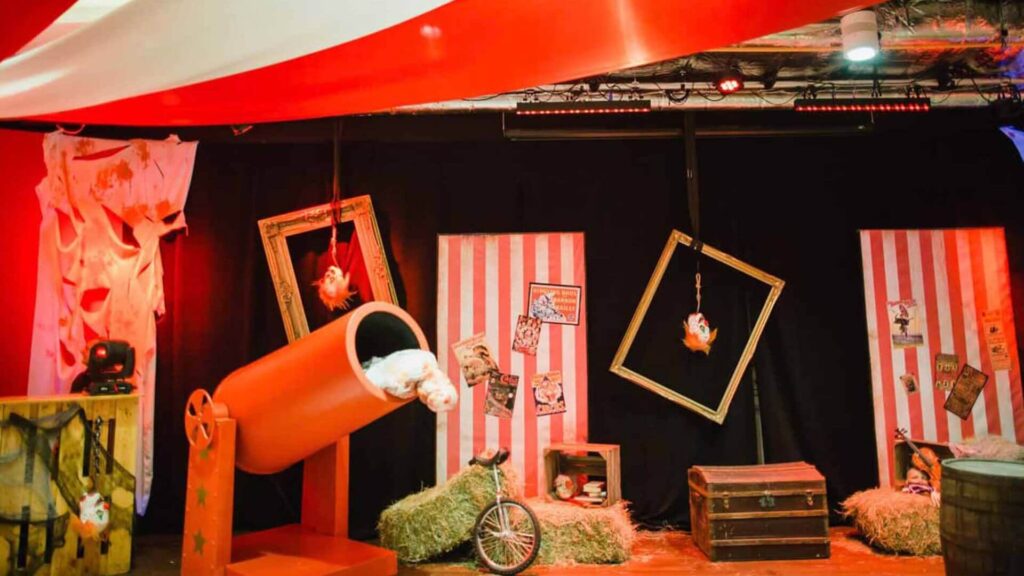 Twisted Circus Themed Event with bespoke draping, backdrops and red cannon prop.