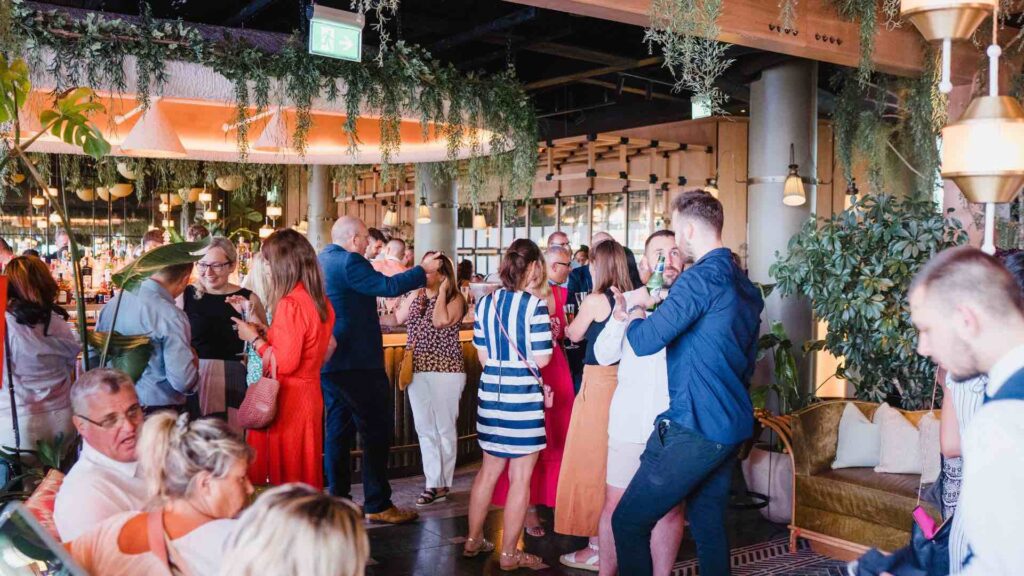 Guests networking at corporate event.