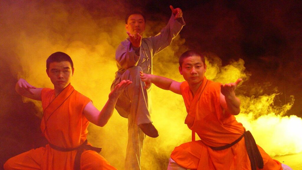 Chinese martial arts performers posing on stage