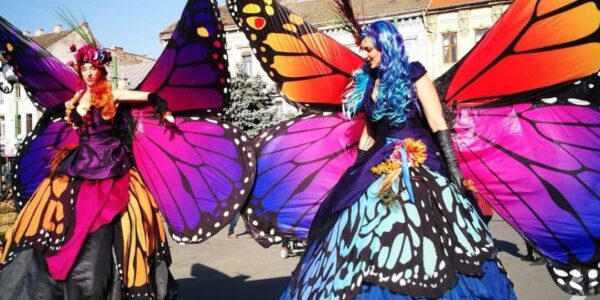 Stilt-Performers-Dressed-As-Butterflies
