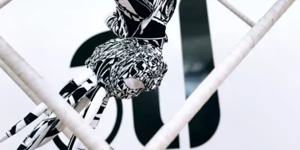 Freestanding-Aerial-Act-In-Black-And-White-Themed-Outfit