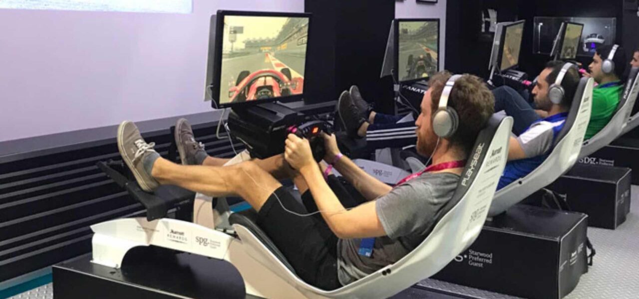 Attendee-Competing-On-Racing-Motorsport-Simulator