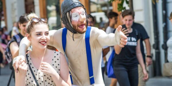 Street-Theatre-Performer-Interacts-With-Lady