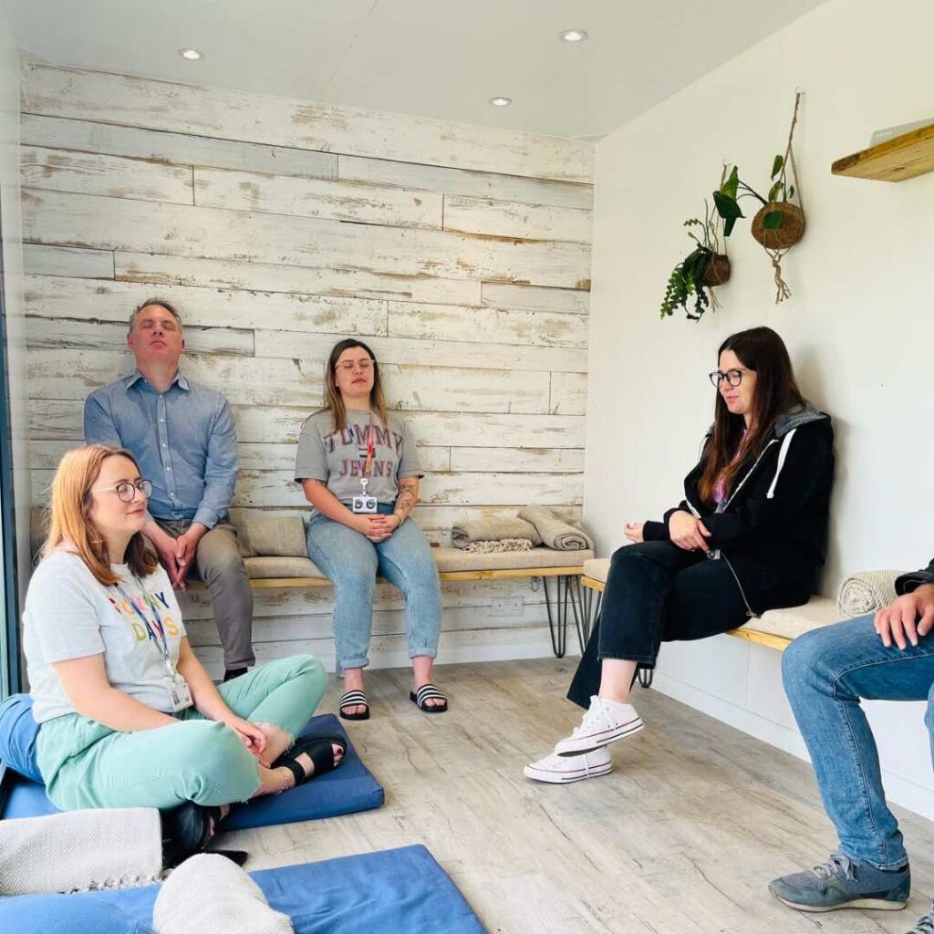 A unique mobile meditation unit with attendees practising mindfulness