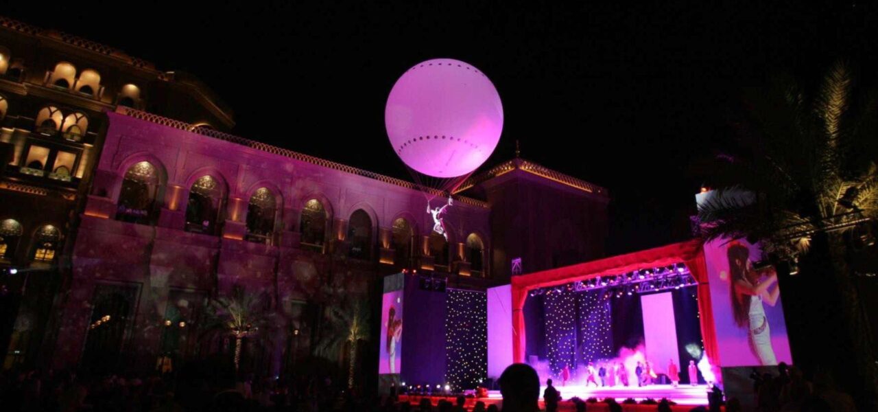 Aerialist-Hanging-From-Balloon-At-Concert