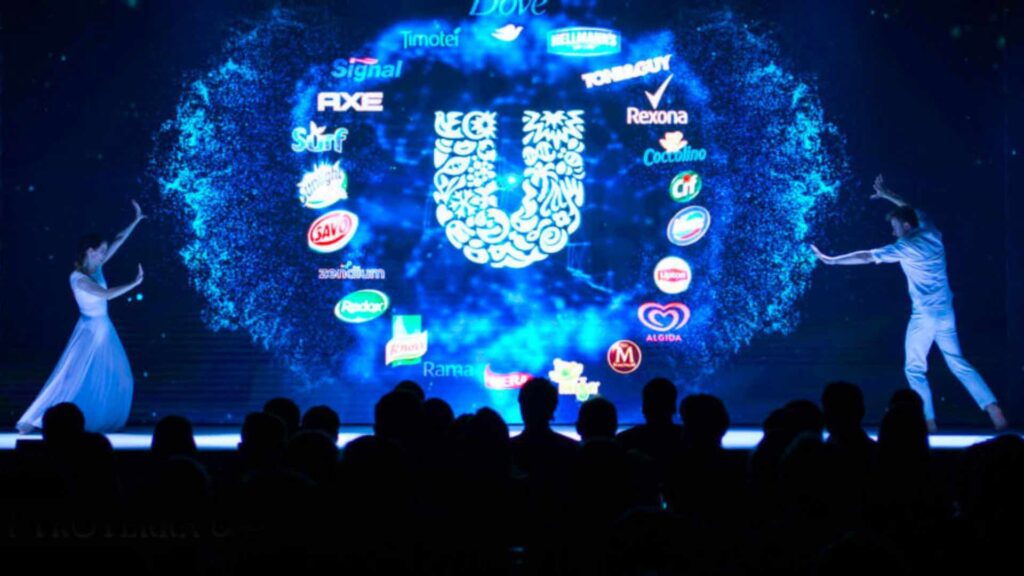 A projection of companies logos at a brand reveal event