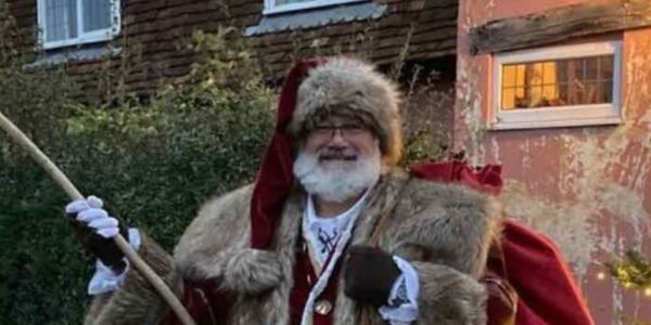 Father-Christmas-Holding-Lantern-Delivering-Presents-Close