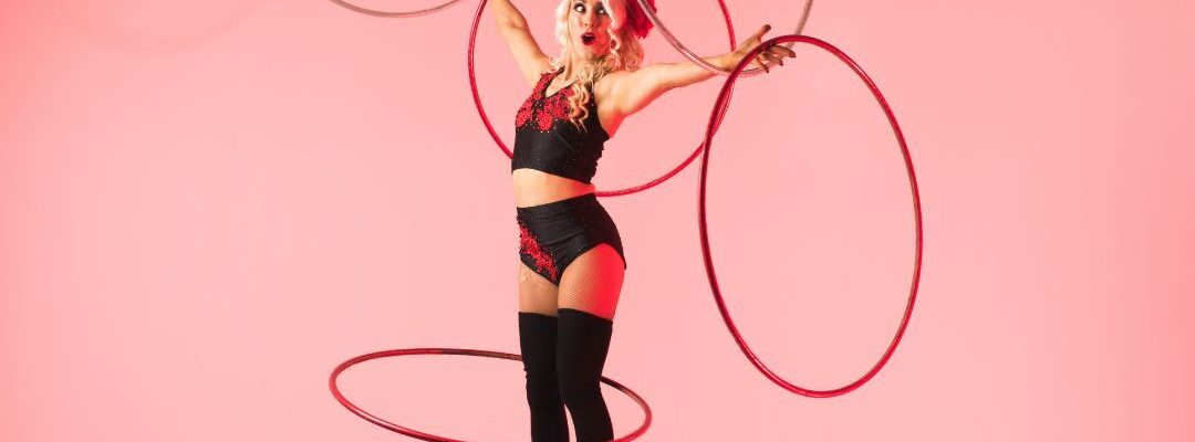 Hoop-Performer-Balancing-On-Balance-Ball Hoop-Performer-Balancing-On-Balance-Ball