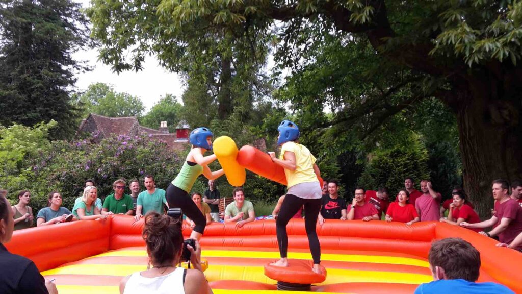 Inflatable gladiator duel game available for family fun days and team building days.
