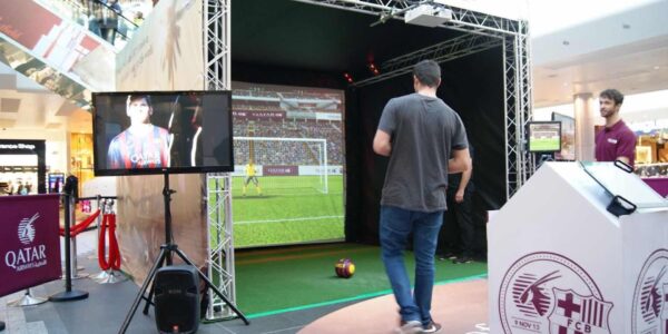 Person-Preparing-To-Kick-Ball-In-Football-Simulator