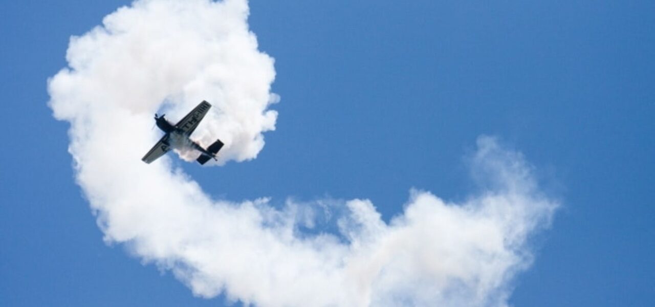 Plane-Creating-Smoke-Writing-In-Sky