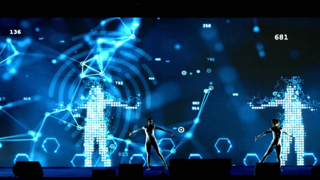 A 3d projection of a lady alongside a 3d projection dancer