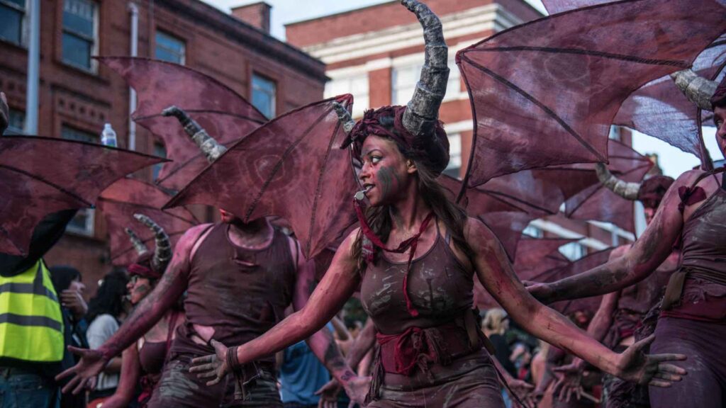 A female dressed in devil costume for halloween parades