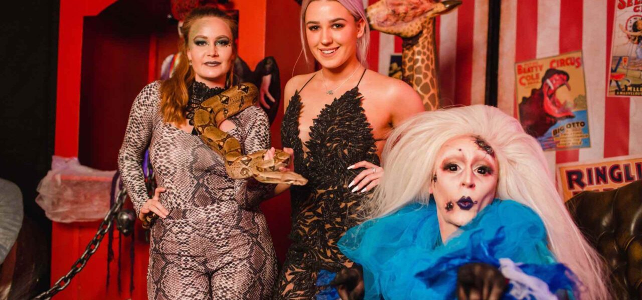 Halloween-Acts-Posing-With-Guest-At-Halloween-Themed-Circus-Party