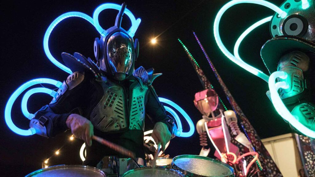 LED light up drummer in a robot costume performing