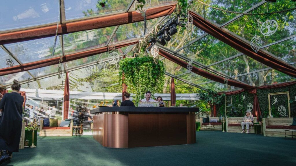 Square copper bar inside clearspan marquee.
