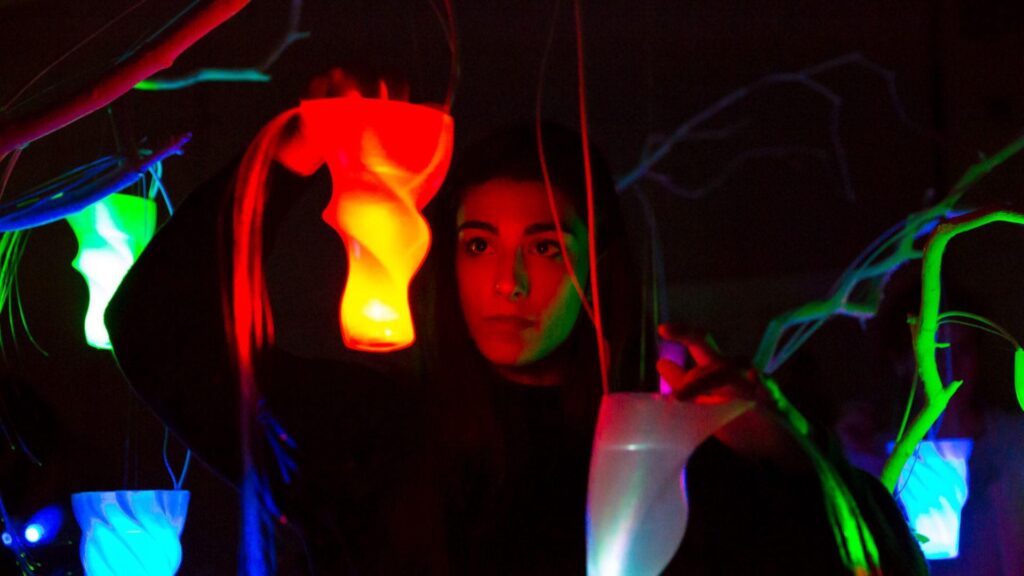 Interactive art installation for a brand exhibition using vivid lights with touch motion sensors.