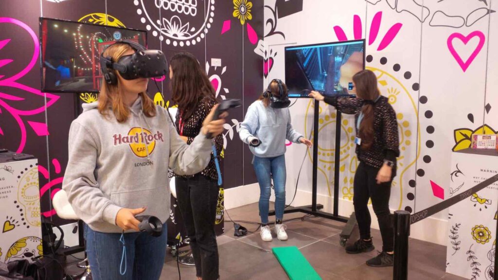 People participate in virtual reality games with headsets on