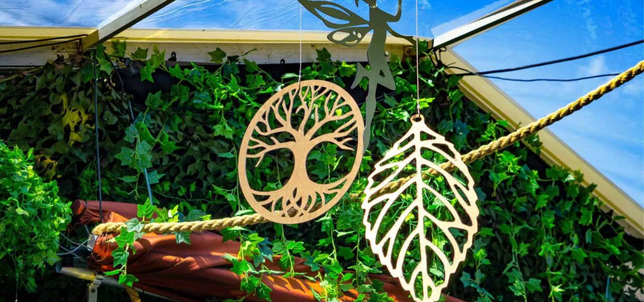 We designed bespoke hanging props and decorations to enhance the design of the enchanted themed garden marquee.