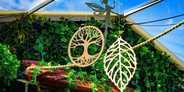 We designed bespoke hanging props and decorations to enhance the design of the enchanted themed garden marquee.