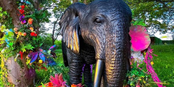 Our giant elephant prop adorned in beautiful blooms and magical foliage for a whimsical forest theme