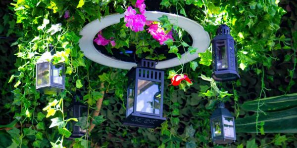 To convey the enchanted forest theme within the marquee, we provided a range of hanging props and green foliage to decorate the marquee ceiling.