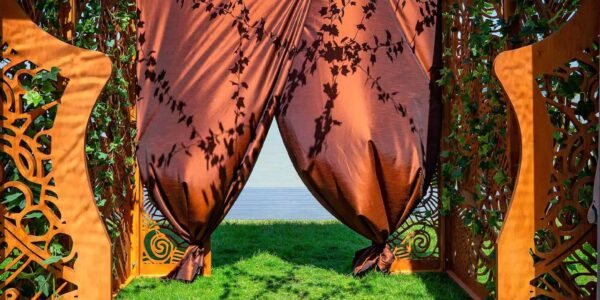 We created a bespoke wooden butterfly entrance to the marquee to create a special feel to the event space. This is the view from the inside, looking out of the marquee.