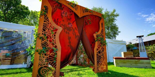 Large butterfly entrance to marquee. We bespoke built this unique entrance to create a wow-factor to the marquee at this private island party.