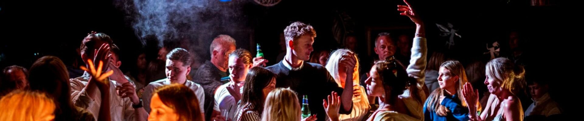 Partying guests at their mystical forest theme event designed by Julia Charles Event Management