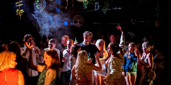 Partying guests at their mystical forest theme event designed by Julia Charles Event Management