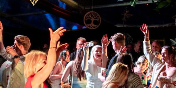 Guest dancing with joy at an enchanted garden themed event produced by Julia Charles Event Management