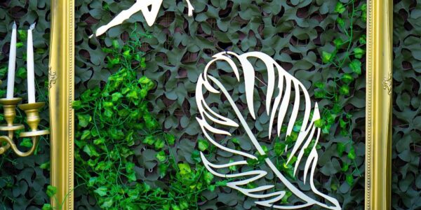 Metallic leaf props used for our enchanted garden theme wall decorations with a small magical fairy