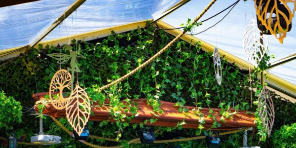 Fairy and leaf canopy in an enchanted garden.